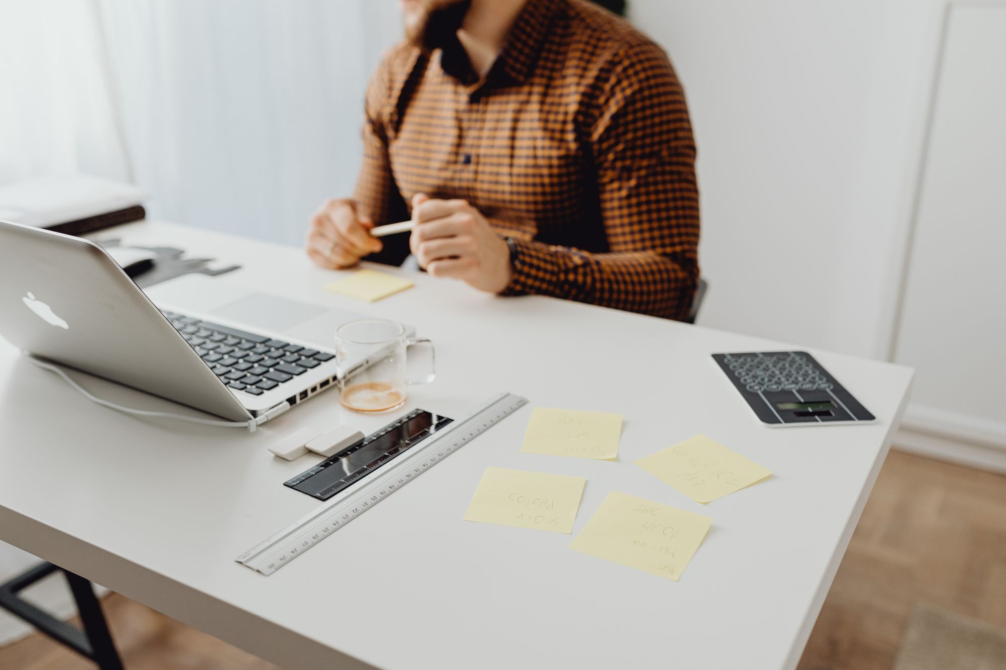 Desk with a laptop and sticky notes