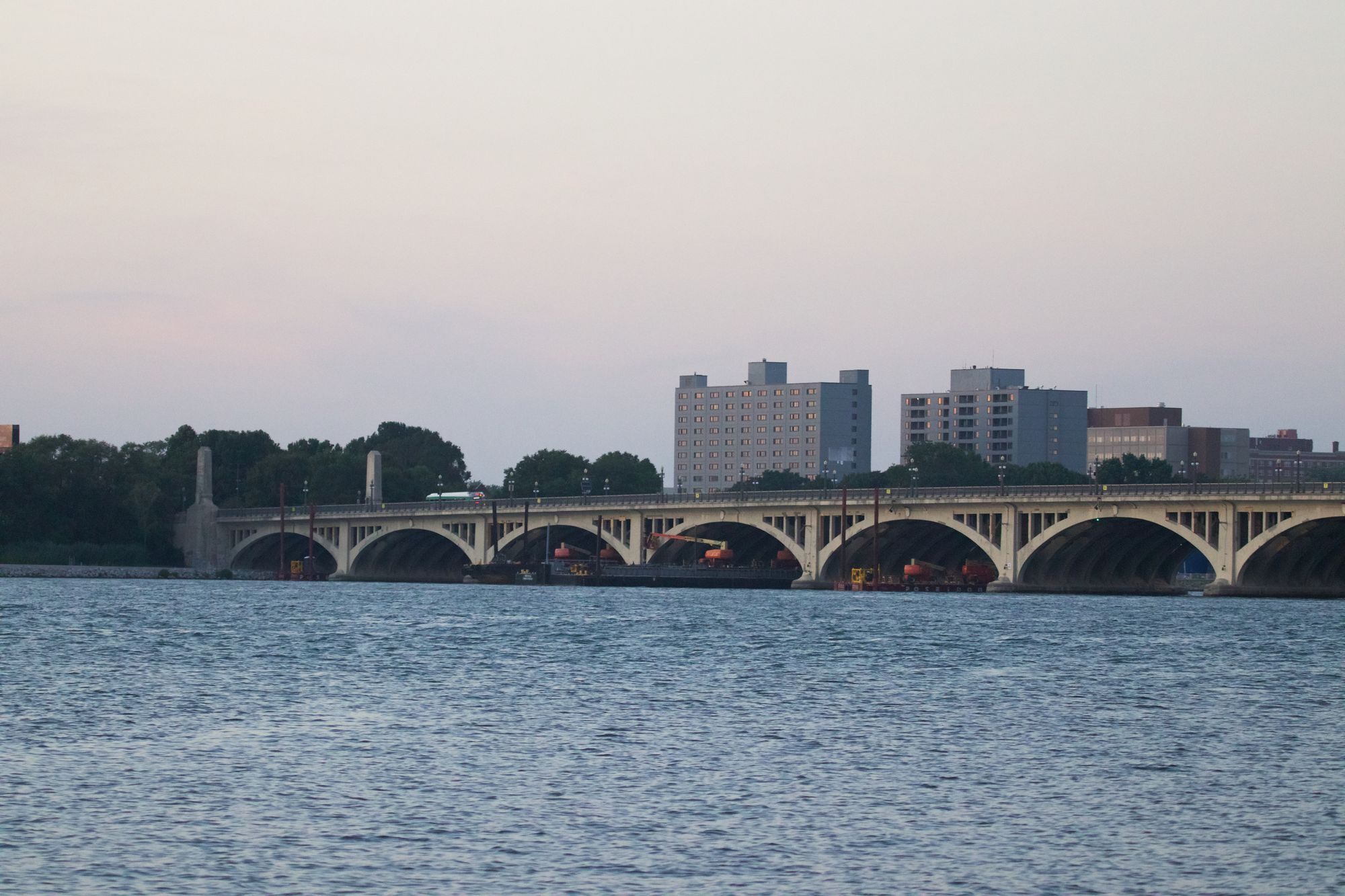 MacArthur Bridge over the Detroit River at twilight with the skyline behind