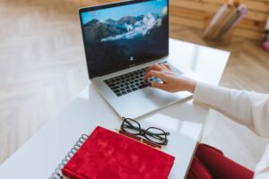 Laptop and notebook on a desk