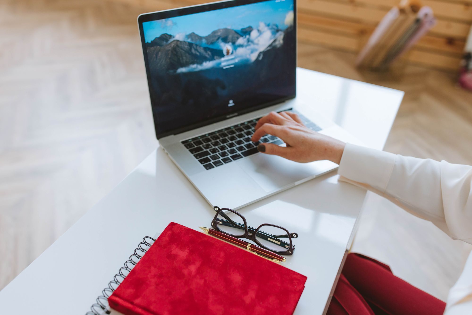 Laptop and notebook on a desk