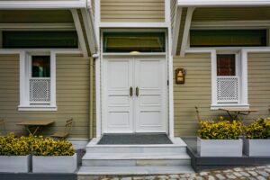 Front door of a house with a white porch