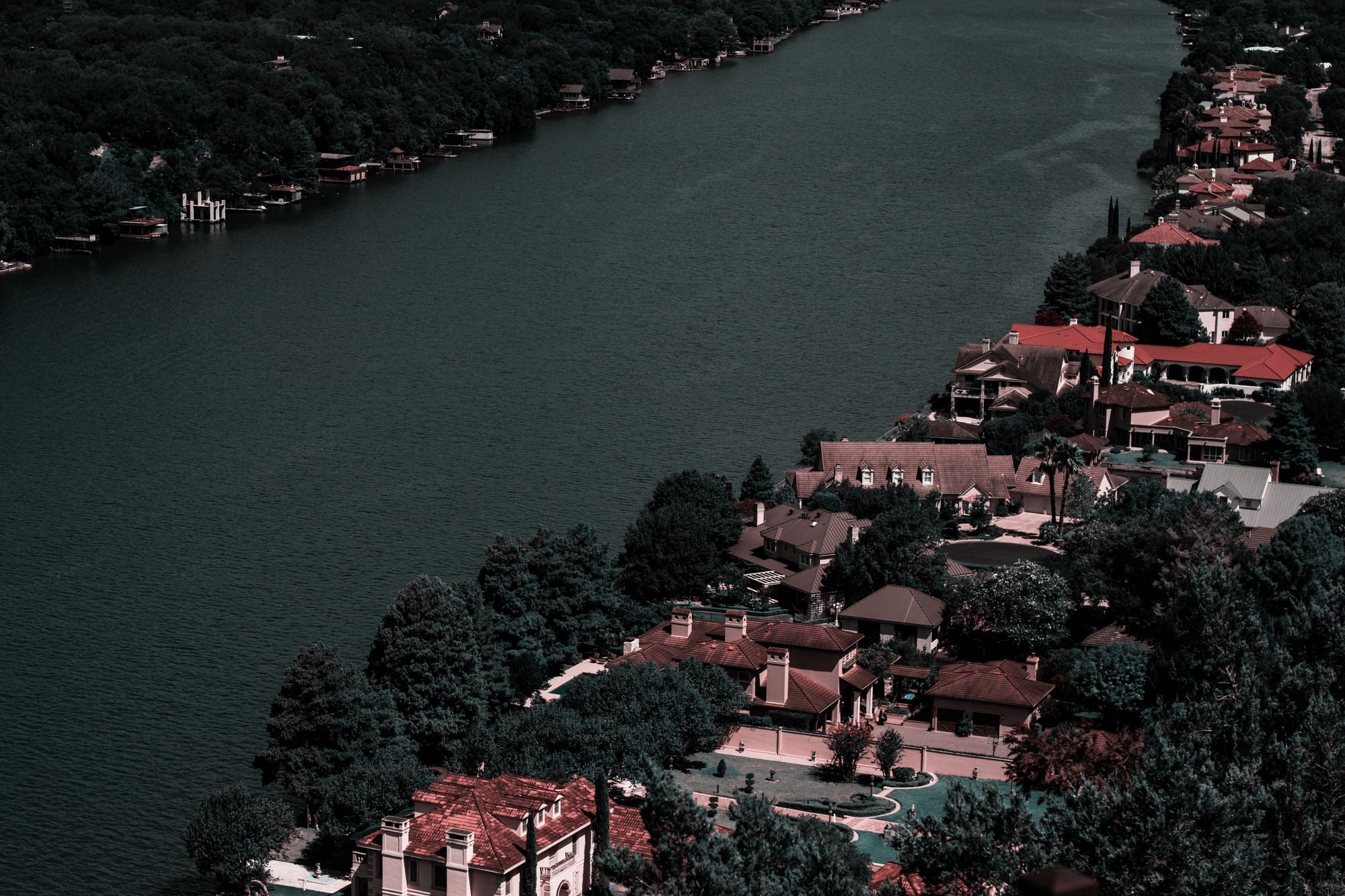 Aerial view of large homes along a river
