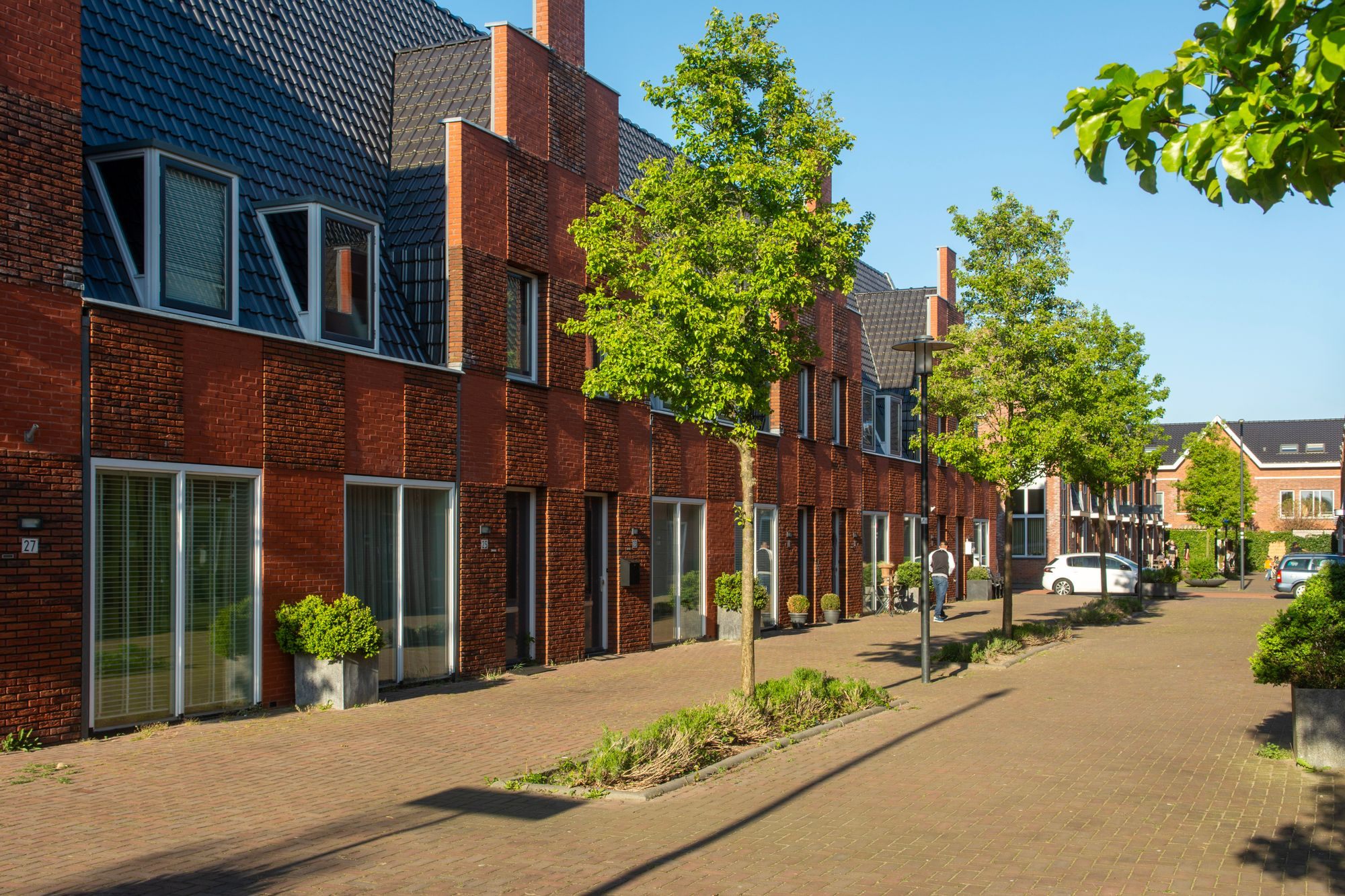 Street of brick row houses on a sunny day