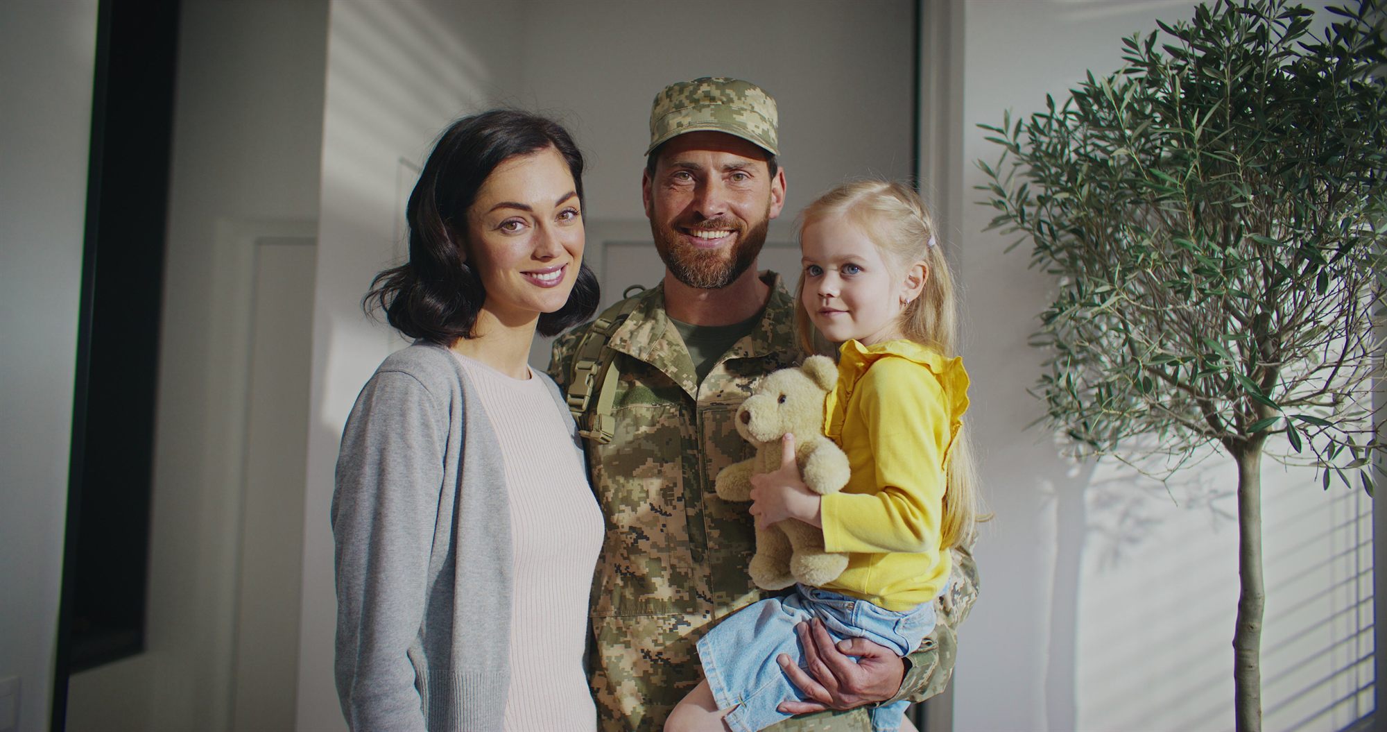 Soldier home with his wife and young daughter