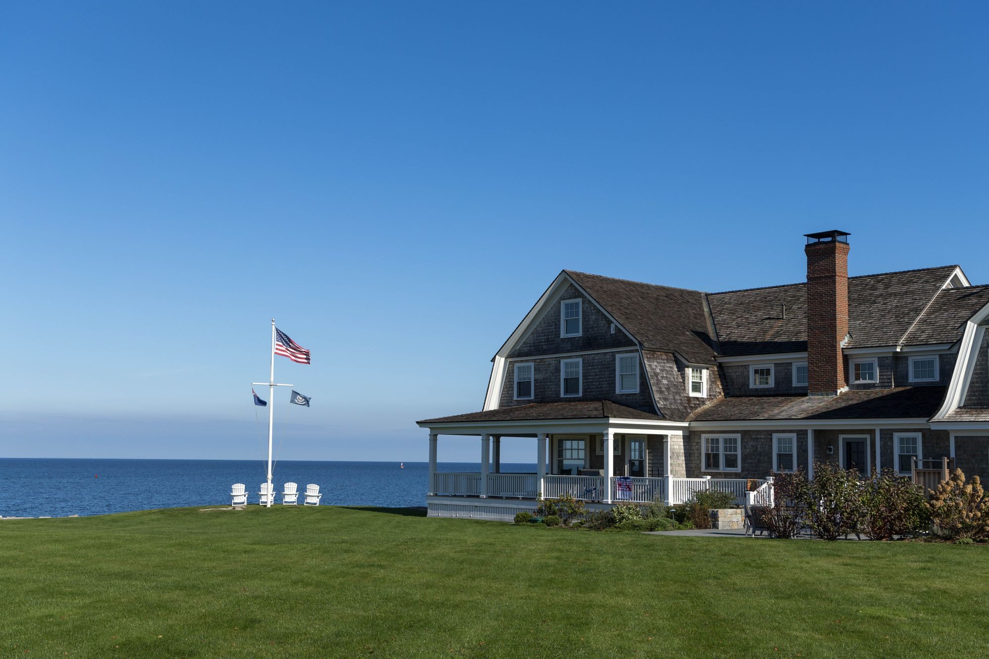 Beachfront house flying an American flag