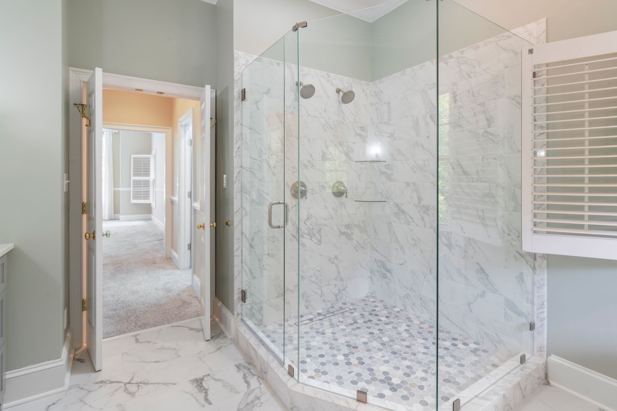 Remodelled bathroom with a marble glass shower