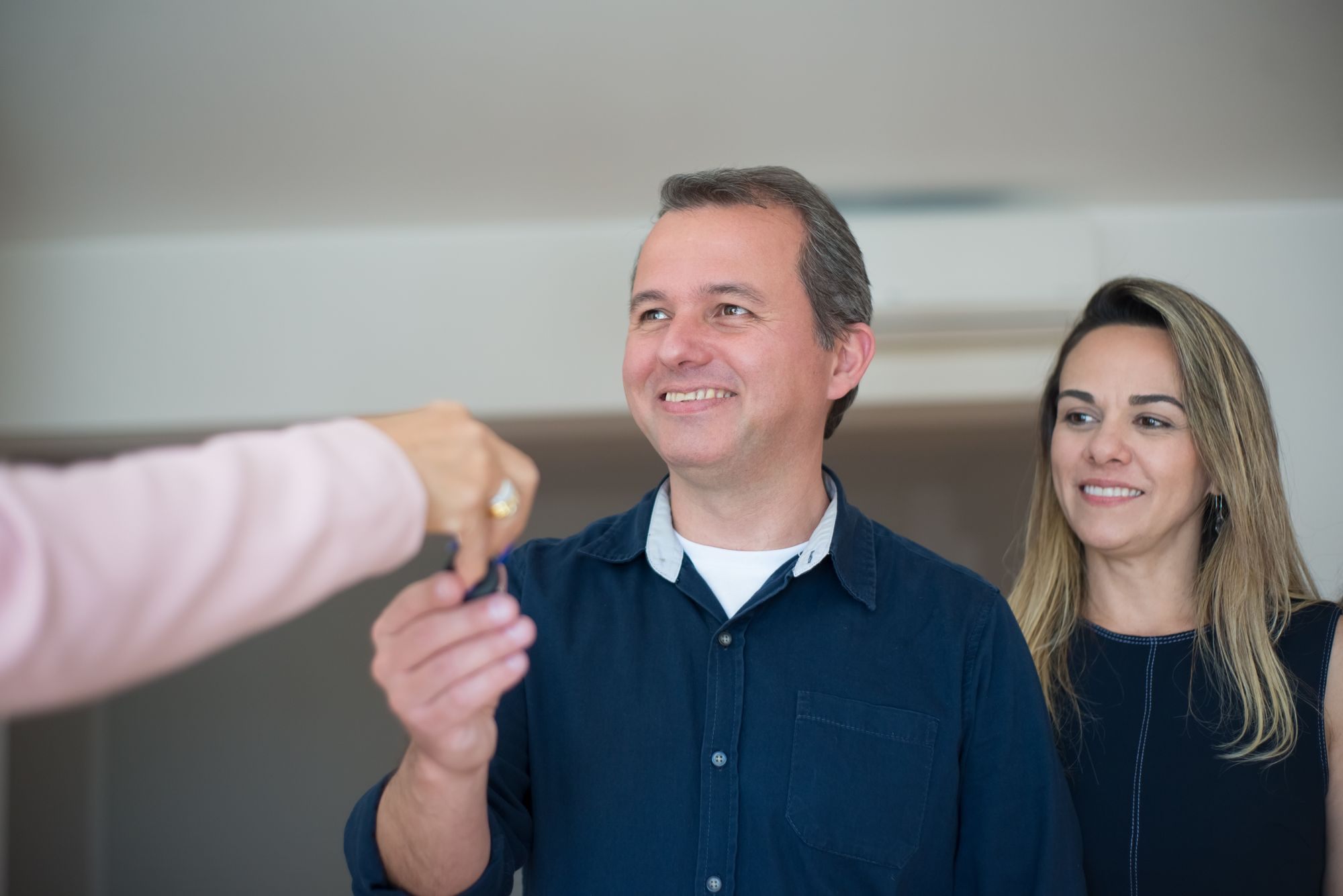 Couple receiving the keys to their new home